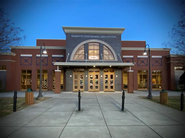 Exterior of MPAC with accent lighting at night